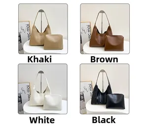 Detail view of large minimalist hobo tote bags with matching pouch in four solid colors