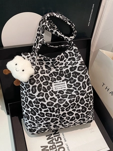 Minimalist black and white leopard print tote bag with a cute cloud charm in a gift box