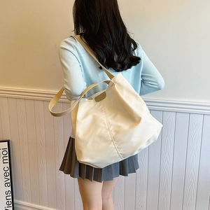 Minimalist beige large capacity canvas tote bag with fashion lettering and woven strap