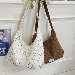 Corduroy tote bag with bear pattern in beige and brown, featuring wide shoulder straps