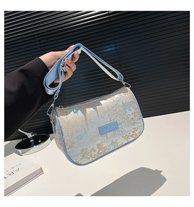 Detail of New Chinese-style embroidered handbag with blue landscape patterns and wide strap