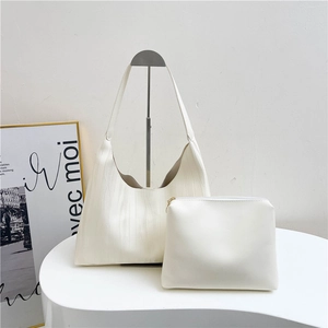 Minimalist white tote bag set with textured shoulder bag and matching zipper clutch pouch