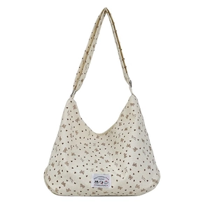 Beige corduroy hobo shoulder bag with brown bow and heart patterns with adjustable strap