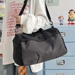Large capacity black sports duffel bag with stylish white grid pattern for travel and fitness