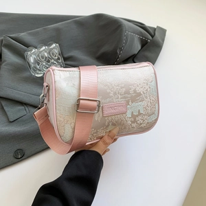 Pink cylinder crossbody bag with traditional Chinese landscape embroidery and wide strap