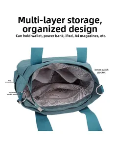 Detail view of the spacious inner compartment with zipper pocket and gray leaf lining