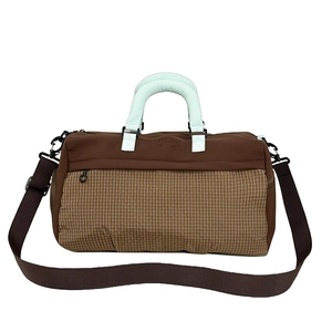 Brown checkered travel gym bag with mint green handles and adjustable shoulder strap