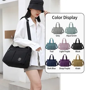 Versatile waterproof nylon shoulder bag with multiple zippers and adjustable strap