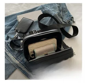 Internal view of black crossbody bag showing space for phone and wallet storage