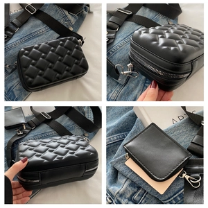 Detail view of black quilted crossbody bag with wide strap and matching coin purse