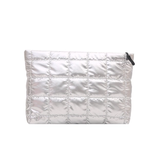 Silver quilted puffer makeup bag with metallic finish and black zipper closure