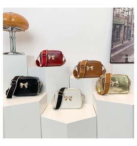Collection of shiny bow-knot crossbody bags with adjustable wide straps in five colors