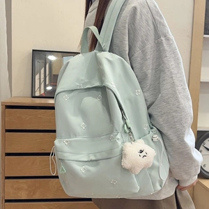 Mint green school backpack with white flower embroidery and plush pendant for students