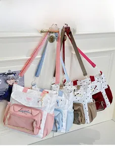 Detailed view of four colorful clear window tote bags with star patterns and cat ears