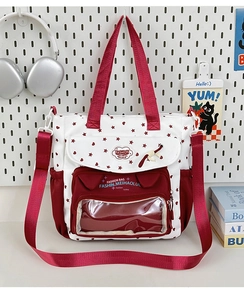 Detail of clear transparent compartment on student tote bag with red star pattern
