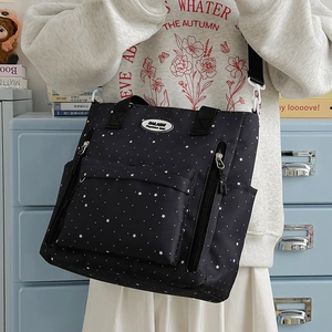 Borsa tote in tela nera con stelle bianche e tasche multiple funzionali con zip