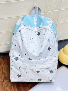 Close-up of stylish star pattern backpack with large letters and durable zipper details