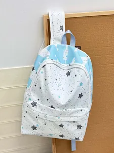 Close-up of star print canvas backpack with large front zipper pocket and strap