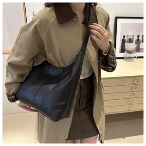 Close-up of black retro hobo bag with vintage leather texture for women