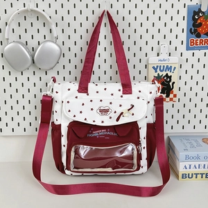 Large capacity transparent ita bag with red star pattern and adjustable strap