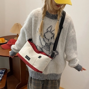 Retro canvas crossbody messenger bag in cream and dark red with adjustable strap
