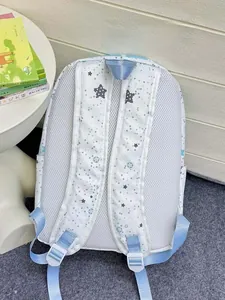 Detail of grey star print backpack showing breathable mesh back and padded straps