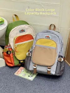Detail view of two large-capacity color-block nylon backpacks with fashion label embroidery
