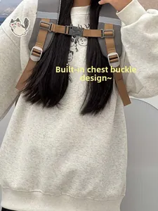 Detail view of adjustable chest buckle and reflective safety strip on nylon backpack strap