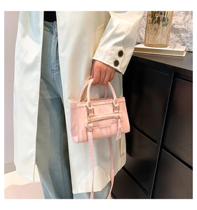 Pink glossy wrinkled texture crossbody bag with metal zipper and adjustable strap
