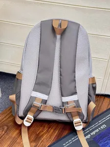 Detail of the ergonomic back panel and breathable mesh straps on the nylon backpack