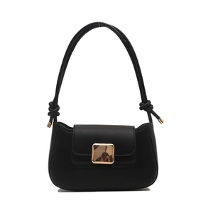 Minimalist black faux leather shoulder bag with a large golden buckle and knot strap detail