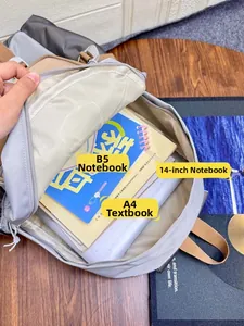 Detail view of large backpack capacity fitting A4 books and a 14-inch laptop