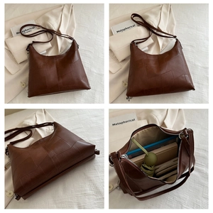 Detail view of brown patchwork tote bag showing large interior capacity for daily essentials