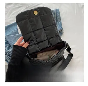 Internal view of black quilted puffer crossbody bag showing spacious storage capacity