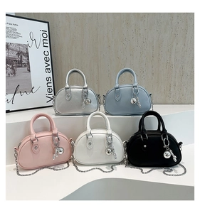Detailed arrangement of mini boston bags in silver, blue, pink, white, and black colors
