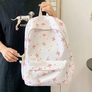 Frischer weißer Rucksack mit roten Schleifenmustern und Fronttasche für Schülerinnen