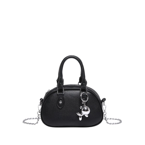 Minimalist black lychee leather bowling bag with silver rabbit charm and chain strap