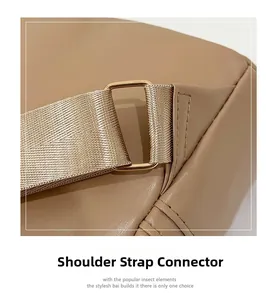 Detail of tan lychee grain leather bag with beige woven strap and gold hardware