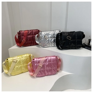 Detailed display of quilted crossbody bags in burgundy, silver, black, yellow, and pink colors