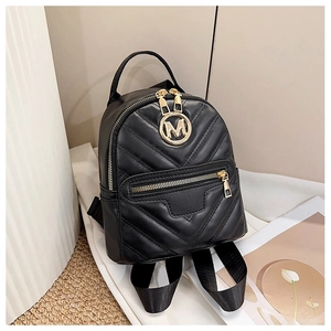 Detail of black quilted leather mini backpack with V-shaped stitching and gold M logo