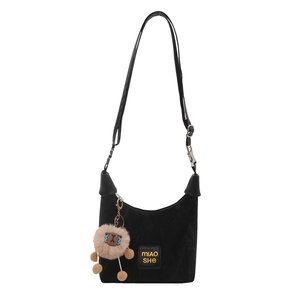 Minimalist black velvet hobo bag with adjustable strap and cute lamb plush pendant charm