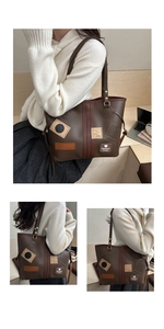 Detailed view of large brown PU leather tote bag with vintage fashion patches and labels