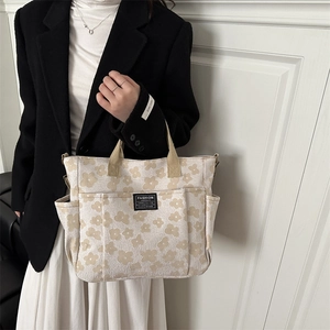 Fashion canvas tote bag with floral patterns and multiple functional pockets for women