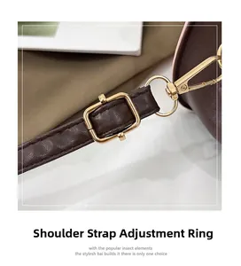 Detail of adjustable dark brown leather shoulder strap with gold-tone hardware and buckle