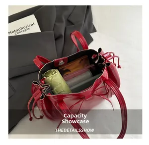 Interior view of the red patent leather tote bag showing large capacity for daily items