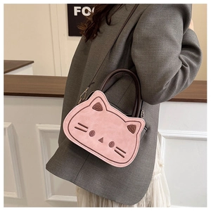 Pink cat-shaped crossbody bag featuring plush ears and brown leather handles detail