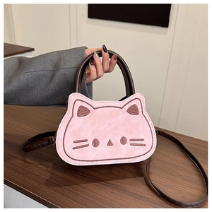 Detail of pink cat-shaped toddler bag with cute embroidery and durable brown handle