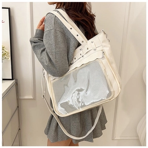 Vue détaillée du grand sac cabas blanc avec poche en filet et œillets métalliques