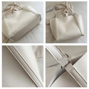 Detailed views of beige PU leather tote bag with fine stitching and silver metal hardware