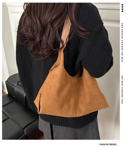 Chic caramel faux suede tote bag shown on shoulder for a stylish retro autumn look